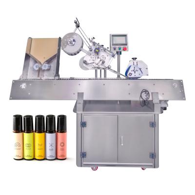 China YM215 Automatische ampul horizontale etiketter applicator voor lipbalsem tube paste etiketteringsmachine Te koop