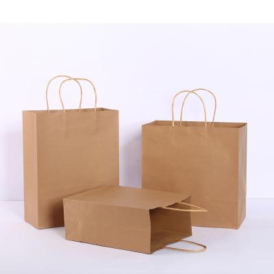 China Custom Lot Kraft Paper Shopping Bags Customized Logo Supermarket Clothes Shoes Paper Tote Bag With Handle Souvenir Bag Part for sale