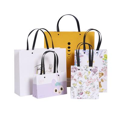 China Custom Logo Packaging Wholesale Gift Shopping Custom Paper Bags With Handles for sale