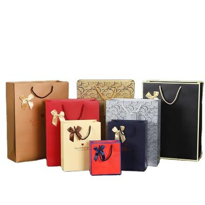 China Custom Custom Paper Bag Clothing Cosmetics Glass Packaging Bag Gift Packaging White Kraft Cardboard Paper Bag Can Print Logo for sale