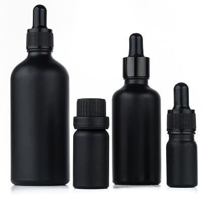 China Eco-friendly Recyclable Matte Black Cosmetic Packaging 10ml 30ml 50ml Print Custom Round Shape Essential Oil Glass Bottle With Cap for sale