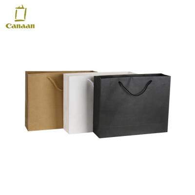 China Recycled Materials Logo Print Shopping Paper Bag Custom Apparel Shoe Packaging Gift Cheap Paper Bag for sale