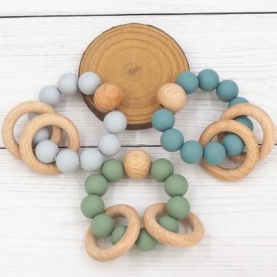 China New Product Natural Wooden Baby Bracelet Teether Toys Eco-Friendly And Develop Sensory Skills Baby Teether Ring Wooden Teething for sale