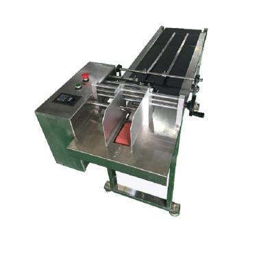 China Narrow Automatic Food Belt Width 300mm Box Paging Machine Paging Machine Mask Feeder for sale