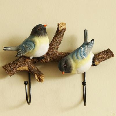 China NIKKY Creative Resin Decorative Nautical Hooks Farmhouse 2 Birds Branches Home Decoration Wall Hooks for sale