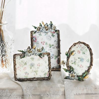 China Alloy Flower Design with Green Leaf Alloy Photo Frames for sale