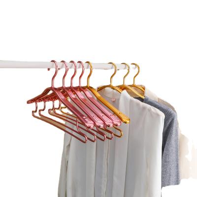 China New custom made high quality eco-friendly pink coat hanger classic/postmodern gold metal from amazon china for sale