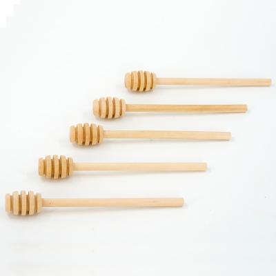 China Viable Custom Logo Spoon Multiple Sizes Quality Natural Honey Stick Dipper Wood Honey for sale