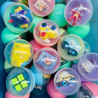 China Hot Sale 100mm Game Mixed Different Toys Eco-friendly Cheap Plastic Capsule Toys Surprise Egg Capsule Egg Box Toy For Vending for sale