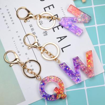 China 2022 Colorful Crystal Resin Handmade Glue Key Chain Gradient Letter Key Chain Accessories Bag Decoration Pendant Sequin Key Chain for sale