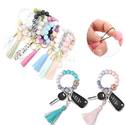 China New Lovely Summer Eco-friendly Food Grade Silicone Beads Acorn Wooden Car PU Key Chain Wristband Bracelet Bead Key Chain Bracelet for sale