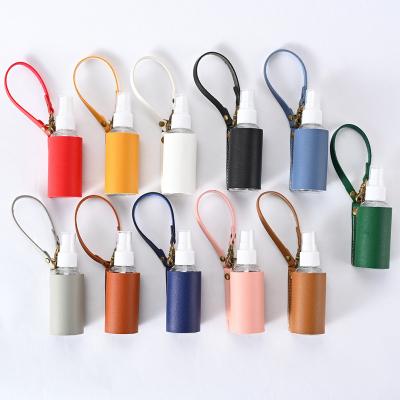 China Personality decoration wholesale hot sale custom multicolor load NEW vacuum the spray bottle PU leather pendant leather keychain for sale