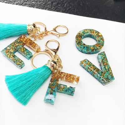 China Factory Wholesale Custom Turquoise and Gold Glitter Tassel Initial Resin Alphabet Letter Key Chain OEM New Eco-Friendly for Women and Girls for sale