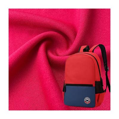 China Twill estilo jersey tejido de punto elástico 75D 100% poliéster para bolso escolar en venta