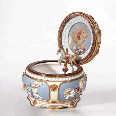 China Splendid music carousel and resin colorful candy color music box can glow and spin wedding hot gifts for sale