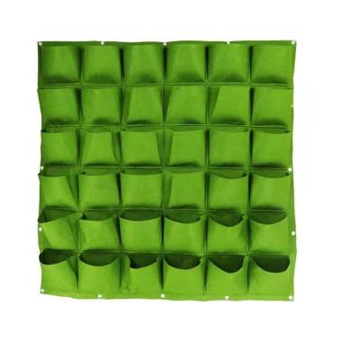 China Amazon Durable Hot Sale Green Felt Material Hanging Planting Pockets Grow Bags Felt Wall Hanging Vertical Planter Grow Bags for sale