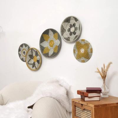 China Modern Boho Natural And Black Decor African Wall Disc Wall Basket Set Vietnam Handicraft Plant Plankton Woven Basket Decor Hanging Set for sale