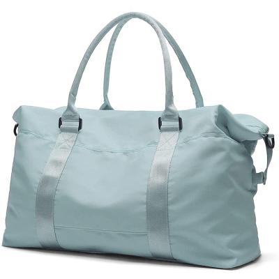 China Fashion Large Capacity Folding Traveling Bags Large Duffel Bag For Female Women for sale