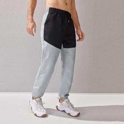 China Spring QUICK DRY Wholesale Polyester Casual Track Pants Drawstring Breathable Black Color Block Anorak Pants Gray Men for sale