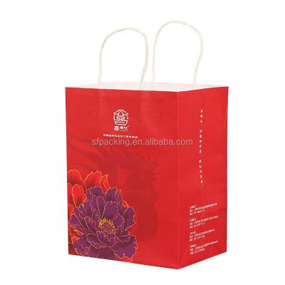 China Recyclable Luxury Red Gift Packaging Kraft Paper Bag For Clothing for sale