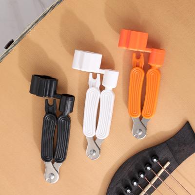 China Three-in-one multi-function GUITAR electric guitar stringer nail/taper/cutter/winder the string changing tool for sale