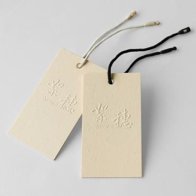 China Viable custom design logo apparel hang tag cotton paper hang tag for clothing garment paper sticker label hang tags for sale