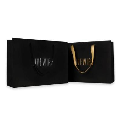 China Recyclable Custom Printed Handle Paper Bag Logo Gold Foil Stamping Gift Shopping Bags, Luxury Black Matte Paper Mall Bag for sale