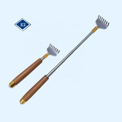 China Stretchable Body Hand Shape Wooden Back Scratcher with Massager for sale