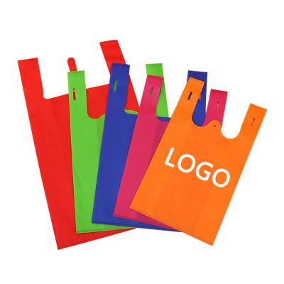 China Custom logo eco vest handle cheap foldable reusable t-shirt w cut non woven bags for shopping for sale