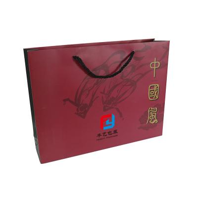 China Custom logo printed gift bags high quality handmade chinese style handbag kraft paper shopping bag art paper for sale