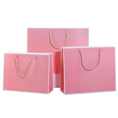 China Recycled Materials Luxury Custom Printed Laminated Packaging Paper Shopping Gift Bag With Logo for sale