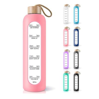 China Sustainable Environmental Protection 1000ml Bamboo Fixed Large Capacity With Rope Lifting Silicone Set With Weather Proof Glass Water Bottle for sale