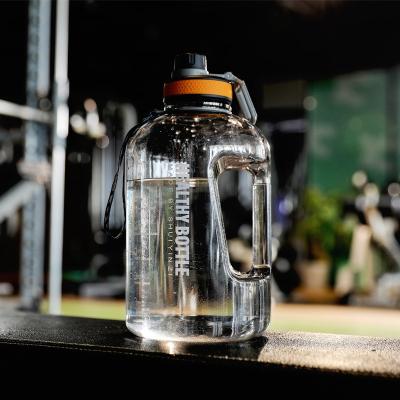 China Sports 2.2L Large Capacity Fitness Logo Fashionable Custom Oversized Bucket Bottle Gradual Water Bottle With Straw And Handle for sale