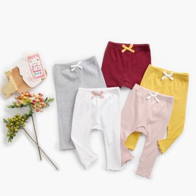 China Boutique Breathable Wholesale Clothing Baby Organic Cotton Ribbed Pants Boy And Girls Tights Gaiters With Bow for sale