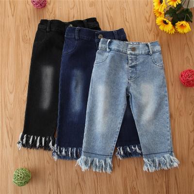 China 2021 spring kids boutique clothing babies cotton breathable jeans with tassel distressed pants fashionable bottoms for sale