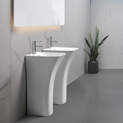 China Contemporary High Quality Totem Modern Design One Piece Wall-hung Ceramic Wash Basin Bathroom Sink for sale