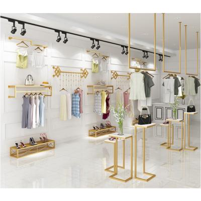 China Europe factory custom designed stainless steel gold women's clothing store display rack display furniture for sale