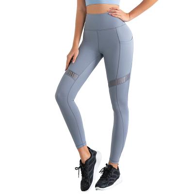 China New Plus Size Breathable Sport Wear Ladies High Waist Yoga Pants With Pockets Shapes Peach Butt Gym Gaiters For Women for sale