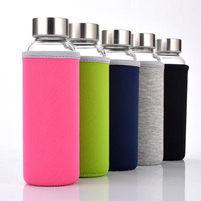 China Viable Motivation Roundg Glass Water Bottle 550ml Single Wall Glass Bottle With Carry Loop for sale