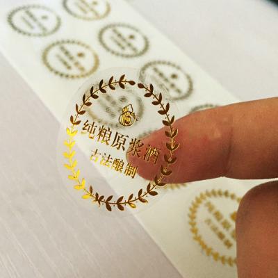 China Custom high quality waterproof luxury foil logo sticker transparent printing goil for sale