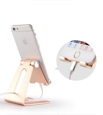 China Adjustable Adjustable Aluminum Cell Phone Stand Space Filler Desk Mobile Phone Tablet Stand for sale