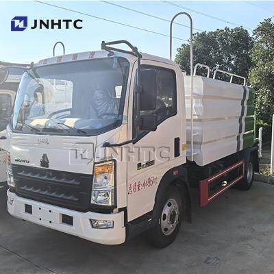 China HOWO Mini 3000L watertruck met mistkanon Multifunctionele stofverwijderende truck voor mijnbouw Te koop