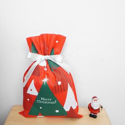 China OEM Christmas Decor Disposable Ultrasonic Nonwoven Drawstring Gift Bag for sale