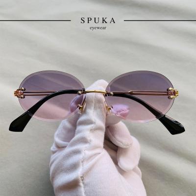 China Fashion Retro Sun Glasses SPUKA 31275 Oval Rimless Lenses Bareback Round Men Women Unisex Sunglasses for sale