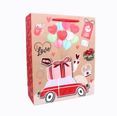 China Newest Hot Sale Customized Recyclable Heart Design Gift Bag Valentine Paper Gift Bag With Ribbon Handle for sale