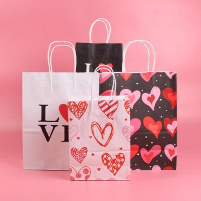 China Newest Customized Printing Recyclable Heart Design Valentine Gift Kraft Paper Gift Bag Kraft Paper Bag With Paper Handle for sale