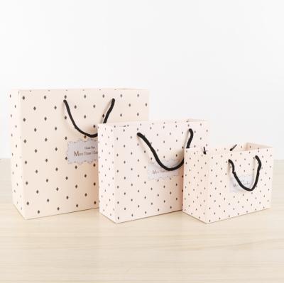 China New Design Customized Daily Printing Various Sizes Paper Bag Gift Cardboard Bag Latest Design Recyclable Whole Sale Lower Price for sale