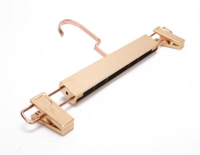 China Non-slip Gold Recycled Plastic Trouser Hanger With Clips for sale