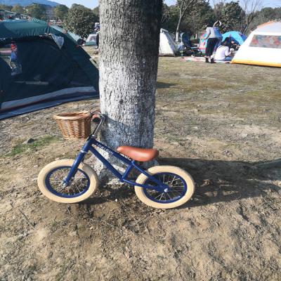 China 2022 Style Kids Walking Bike for Baby with Front Wicker Basket and Wanda 12 Inch Tires for sale