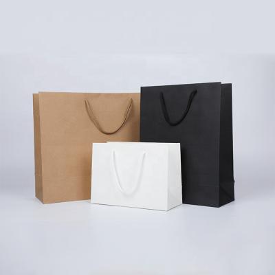 China Recycled Materials Brown Cardboard Paper Shopping Bag Packaging Bags For Clothes Shoes Jewelry Accessory for sale